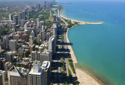 arial view of city with beach and deep blue ocean